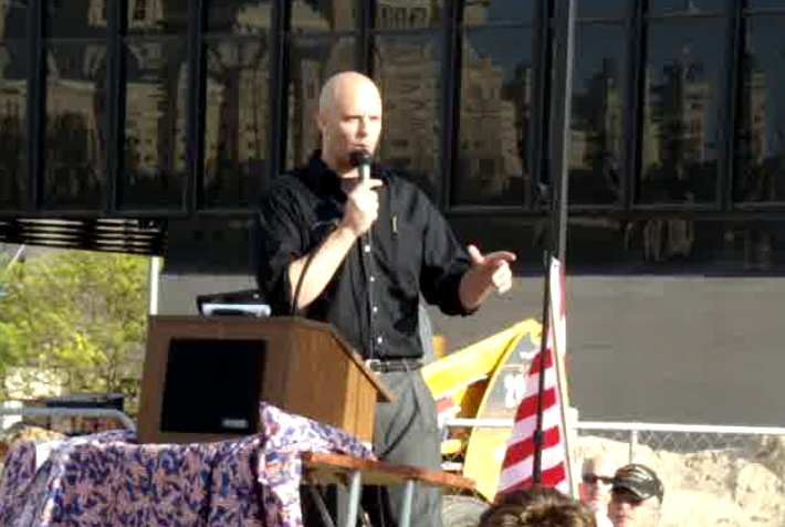 David speaking to a large crowd.